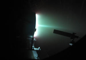 Photo showing the X2 thruster and collection optics during a recent time-averaged LIF test.