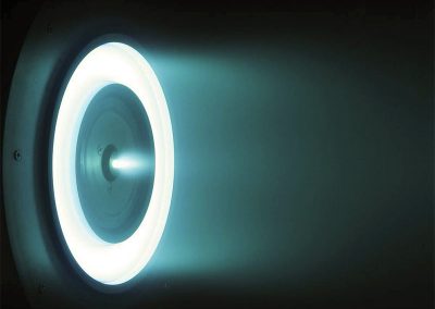 Photograph of the 6-kW Hall thruster during operation at nominal conditions of 300 V and 20 mg/s (6 kW). (From ref. 4.)